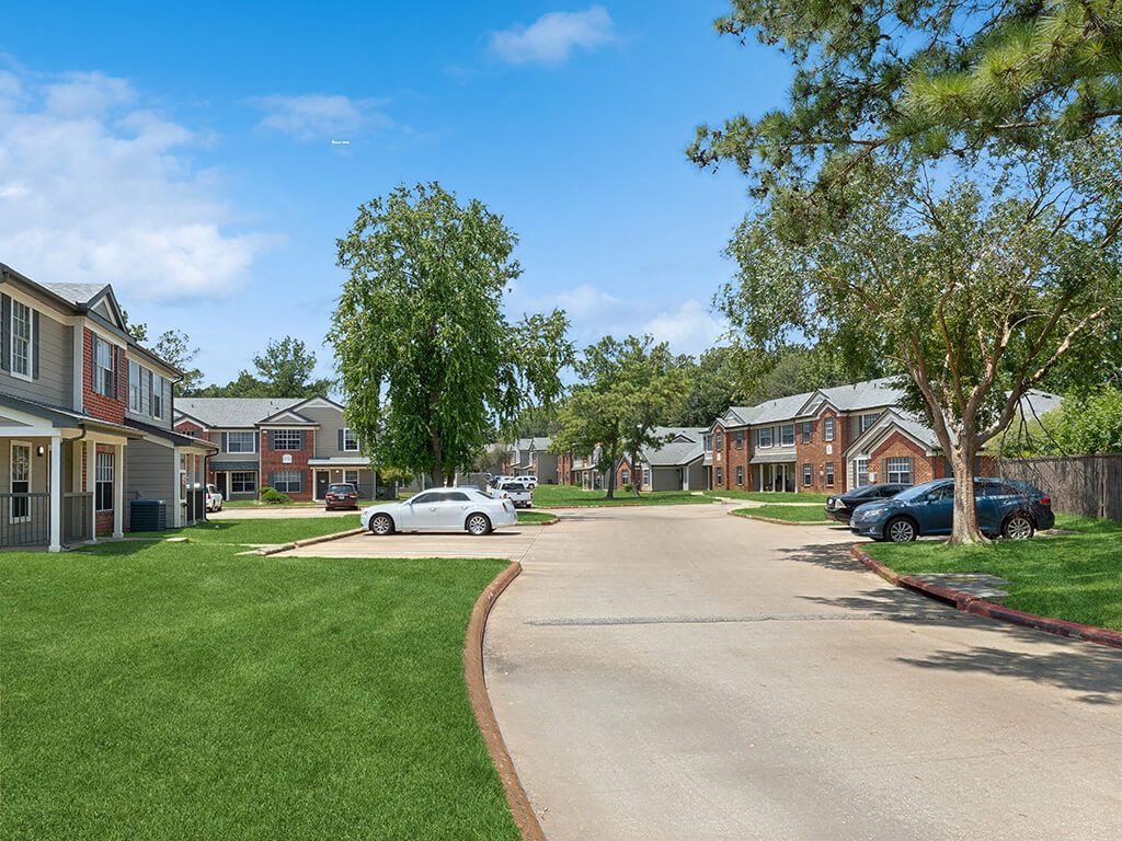 Building exterior lawn at Park Village Apartments in Conroe TX
